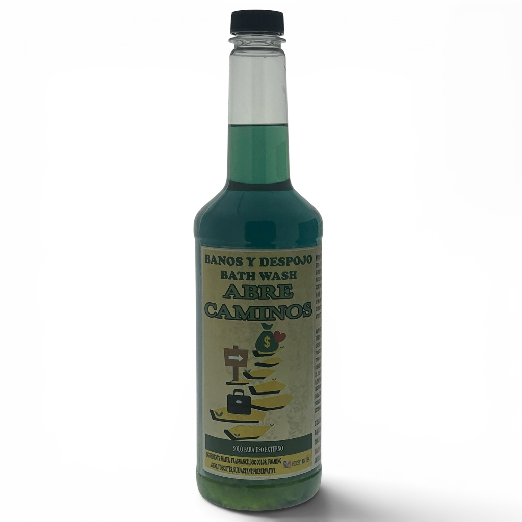 A bottle of Abre Caminos bath wash with green liquid inside, featuring a beige label with a tree illustration and a black cap, set against a plain white background.