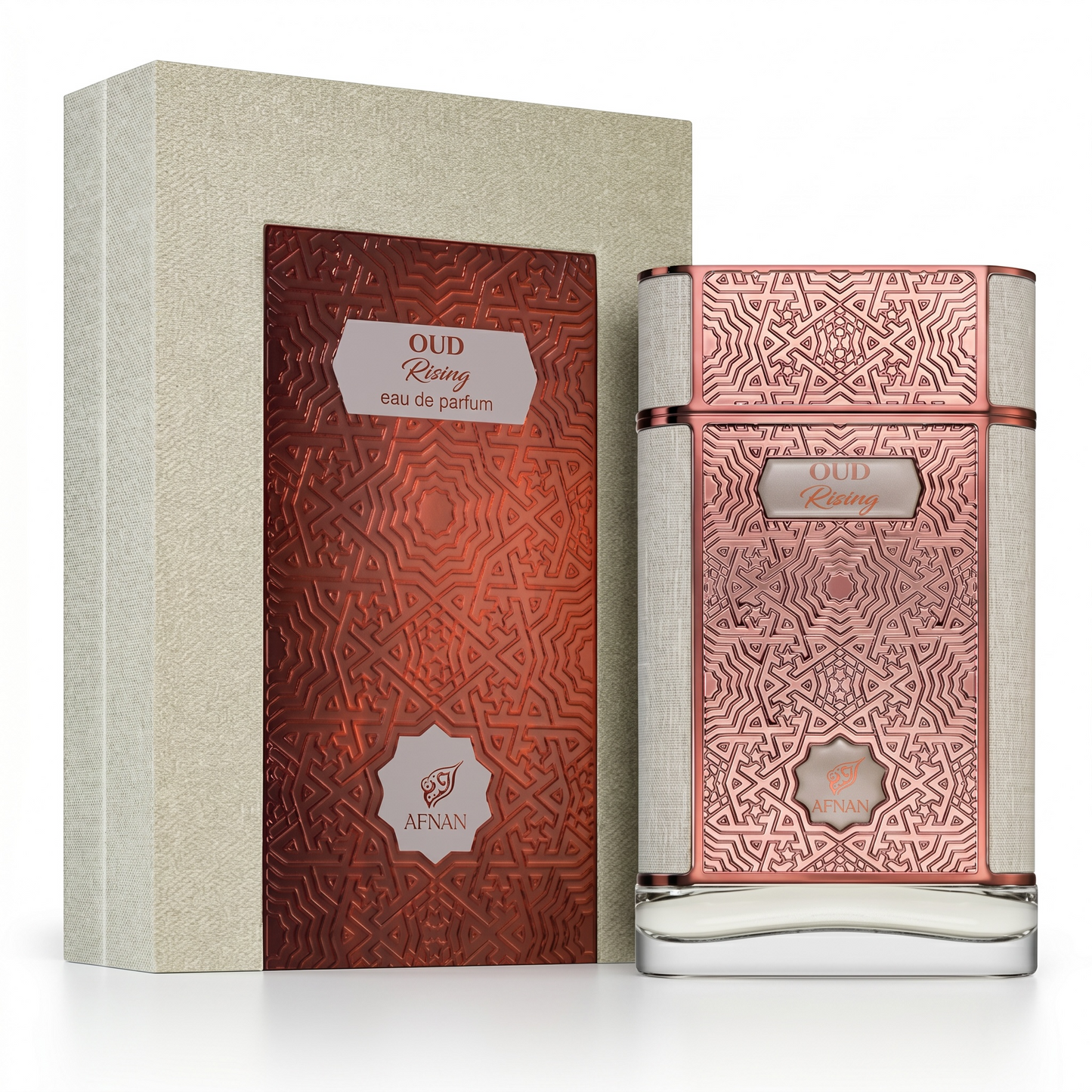 Perfume bottle and packaging with intricate designs on a white background