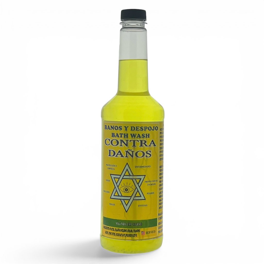 A bottle of bath wash with a yellow label and yellow liquid inside, featuring a black cap and Spanish text reading 'BATH WASH CONTRA DAÑOS'.