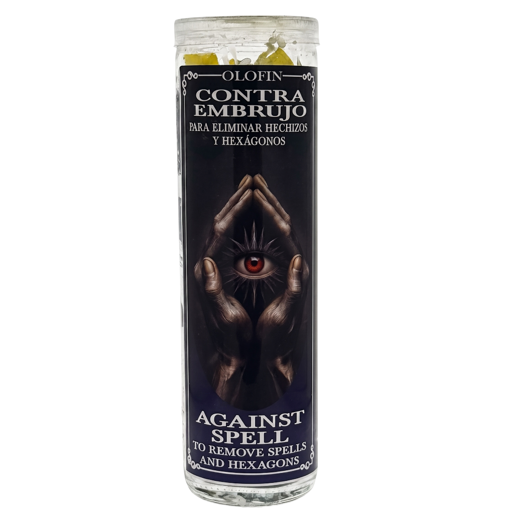 A tall glass jar candle with a black label featuring a dark illustration of hands holding up an eye with a red pupil. The label reads 'OLOFIN CONTRA EMBUJO PARA ELIMINAR HECHIZOS Y HEXÁGONOS' and 'AGAINST SPELL TO REMOVE SPELLS AND HEXAGONS'.