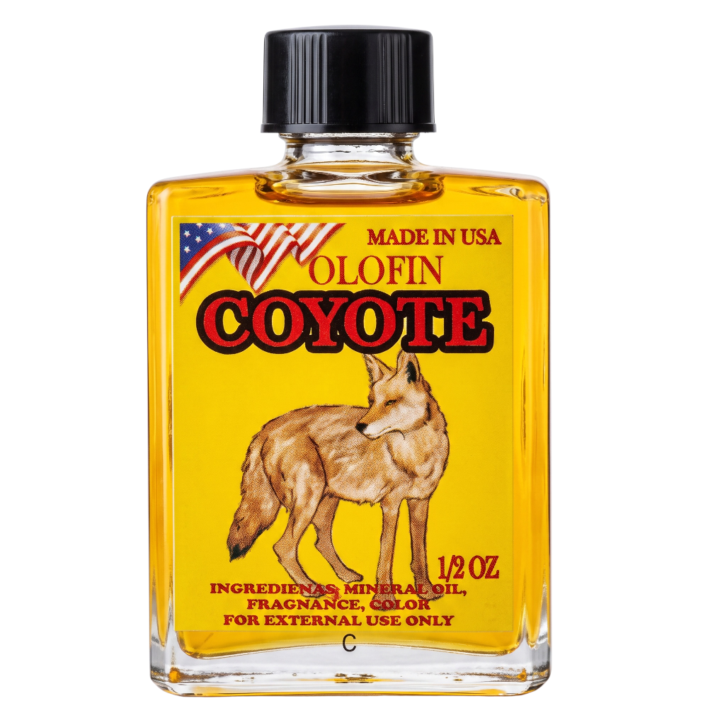 A 1/2 oz glass bottle of Olofin Coyote fragrance oil with a black cap, featuring a yellow label with a coyote illustration and American flag graphic.