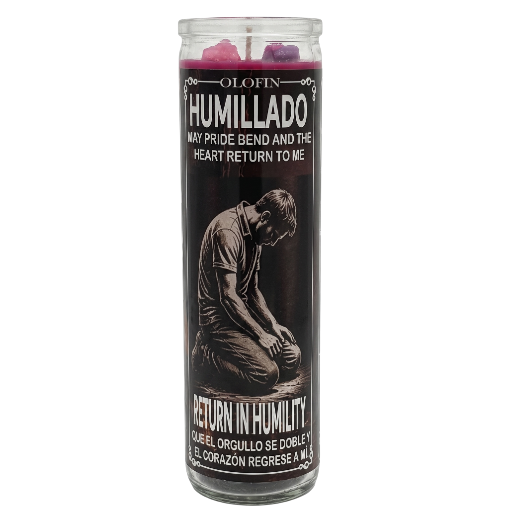A tall glass jar candle with a black label featuring a kneeling man illustration and Spanish text, including 'OLOFIN HUMILLADO' and 'RETURN IN HUMILITY'. The wax at the top is dark purple/magenta.