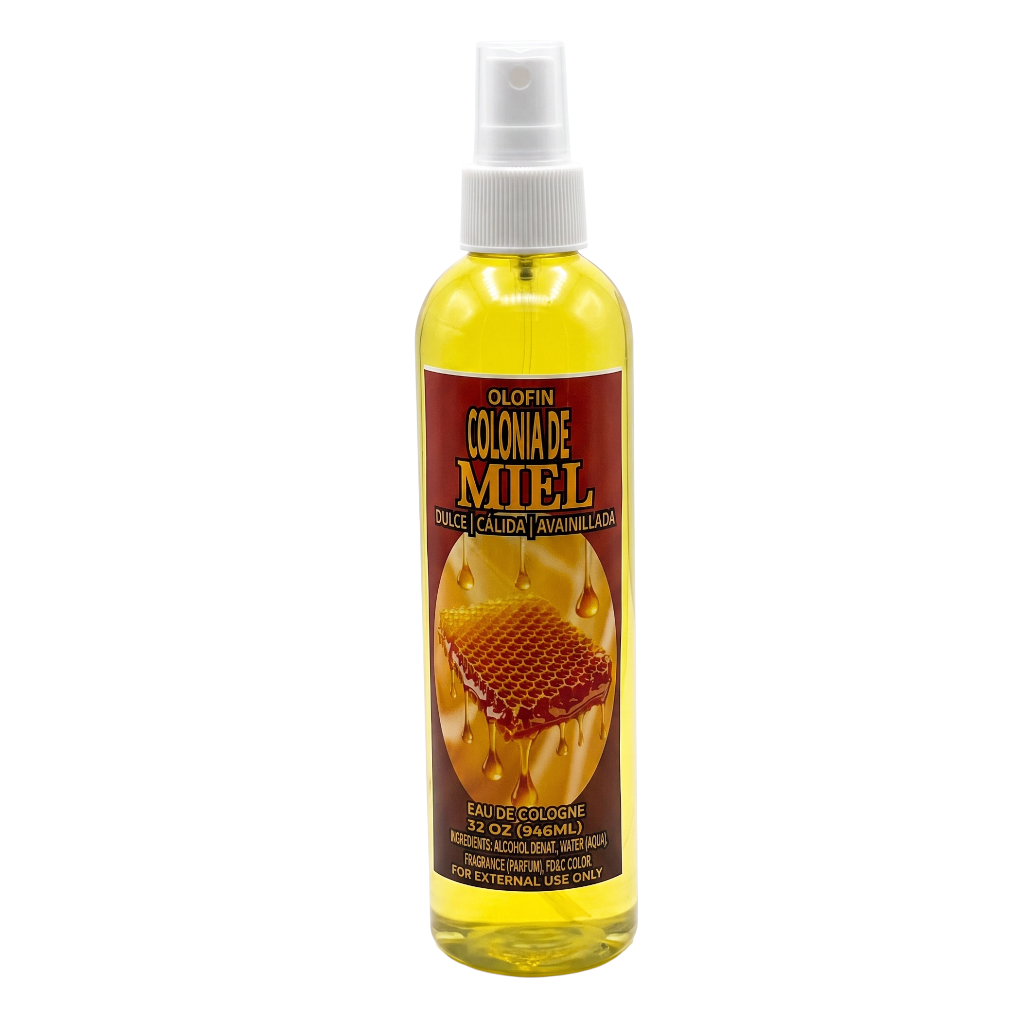 A bottle of Olfeni Colonia de Miel (honey scent) Eau de Cologne, featuring a white spray nozzle and a label with yellow honey and a red background, set against a plain white background.