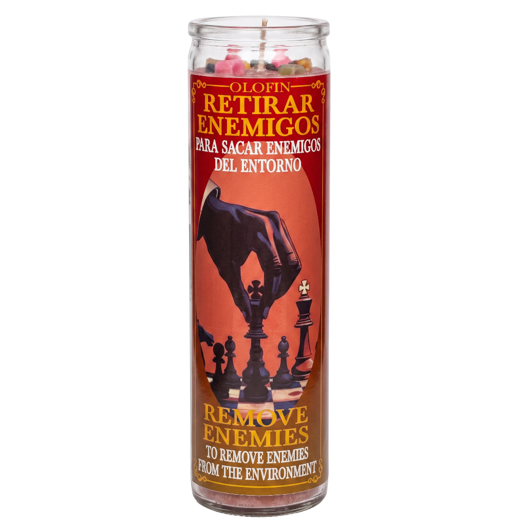 A tall glass jar candle with a red and orange label featuring a black chess-piece graphic and Spanish text reading 'Olofin Retirar Enemigos' and 'Remove Enemies to Remove Enemies from the Environment.'.