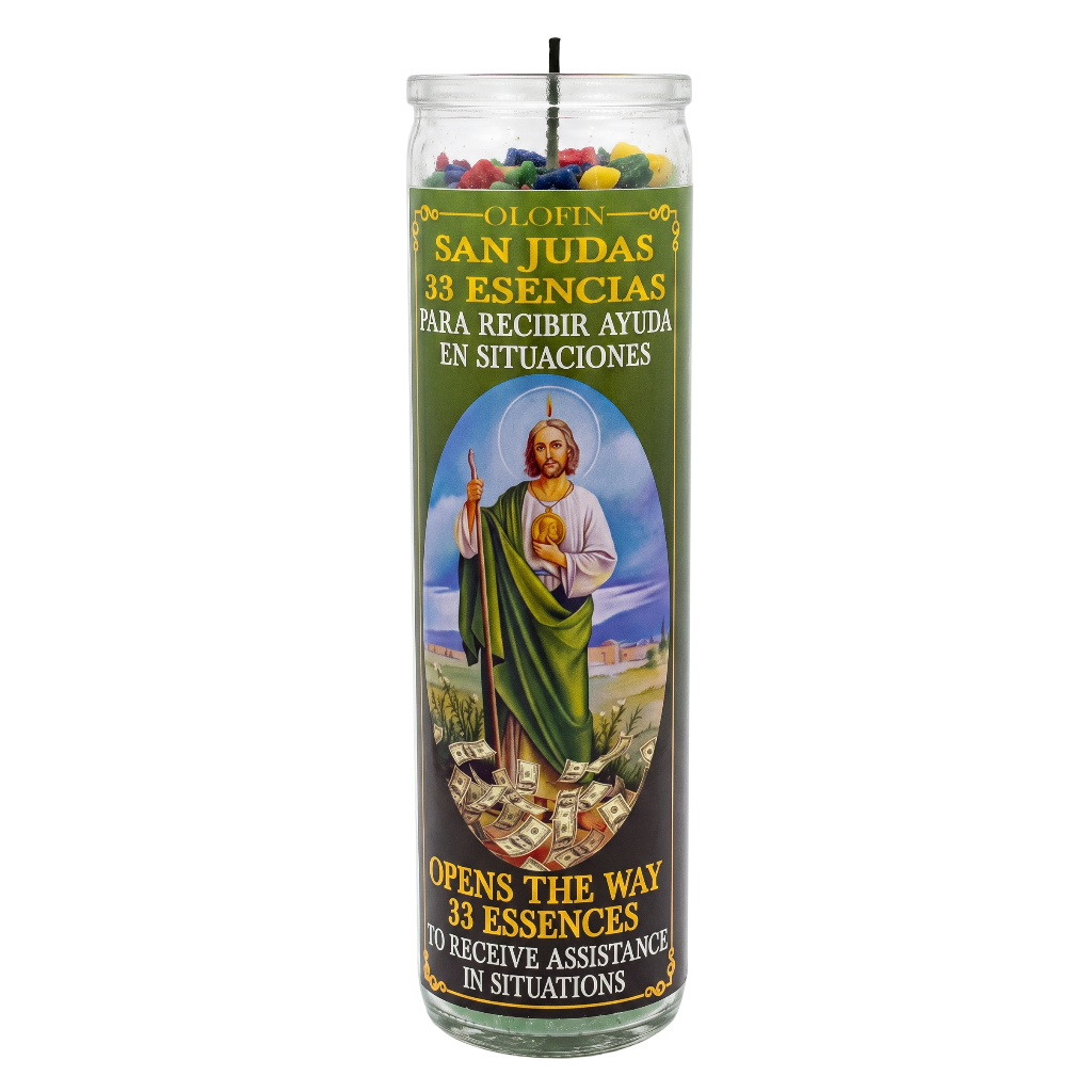 A tall glass prayer candle with a colorful label featuring Saint Jude Thaddeus and Spanish and English text, shown on a plain white background.