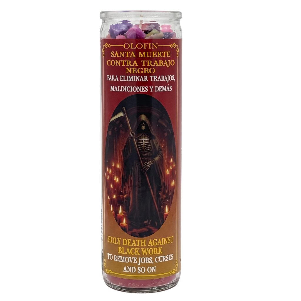 A tall glass jar candle with a red and black label featuring a grim reaper illustration. The top of the candle is filled with purple and pink wax pieces.