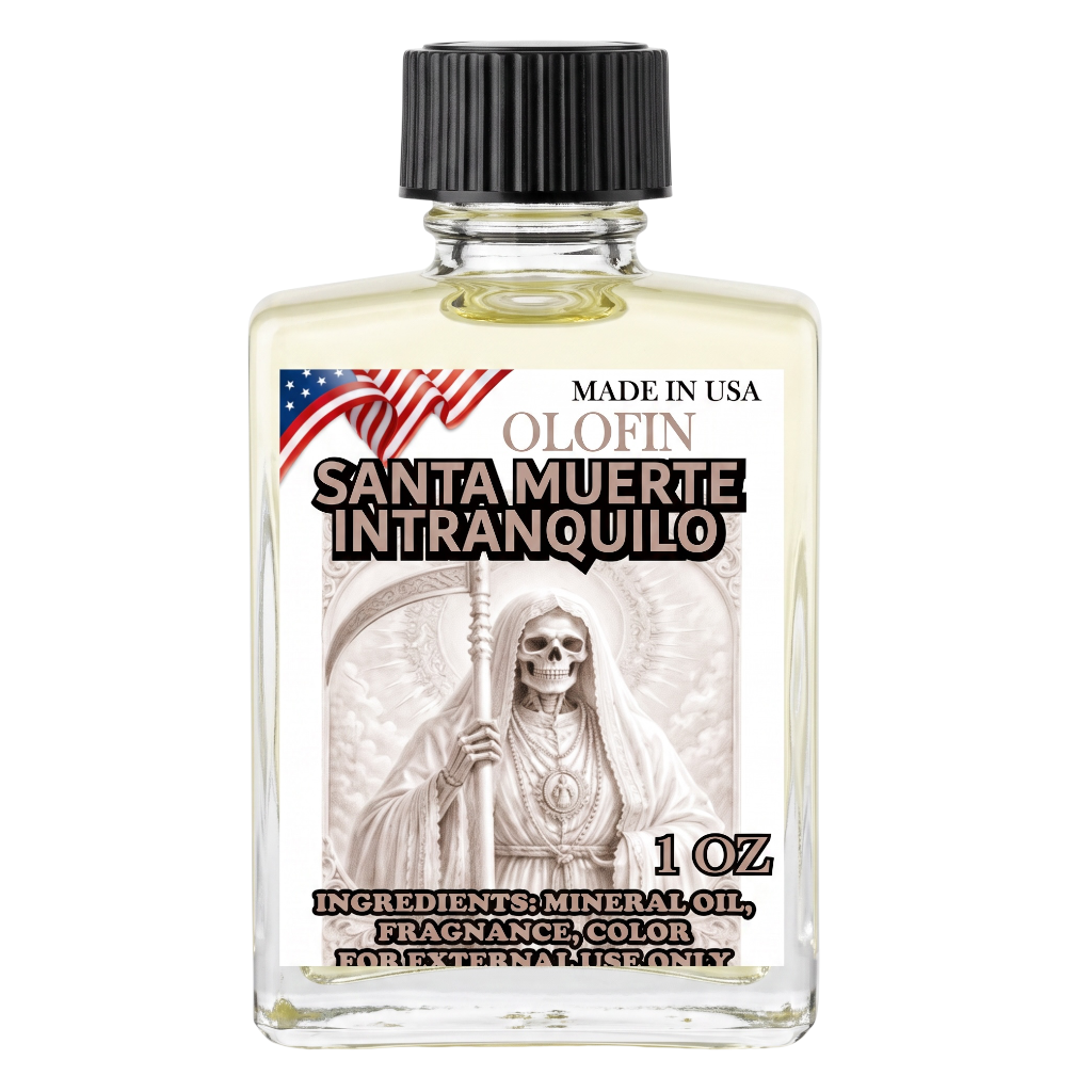 A 1 oz clear glass bottle of Olofin Santa Muerte Intranquilo fragrance oil with a black ribbed cap and a detailed front label featuring a skeleton saint illustration and an American flag.