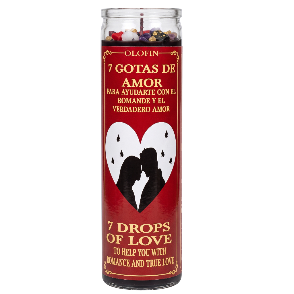 A tall glass jar candle with a red label featuring Spanish and English text, a white heart with a black couple silhouette, and multicolored drops visible at the top. The label reads 'Olofin' and '7 Gotas de Amor / 7 Drops of Love'.