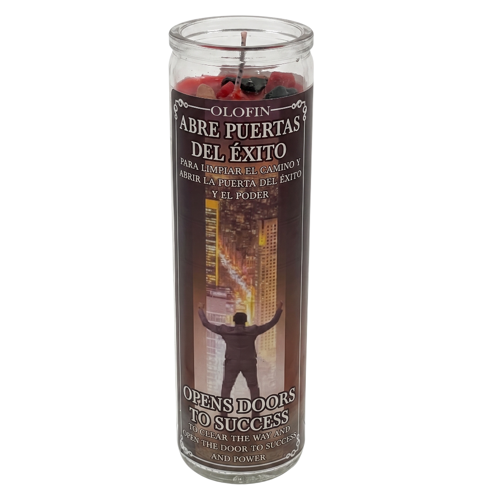 A tall glass jar candle with a dark brown label featuring Spanish text 'Olofin Abre Puertas Del Éxito' and an illustration of a person with raised arms in front of a city skyline. Red wax is visible at the top, and the candle is photographed on a plain white background.