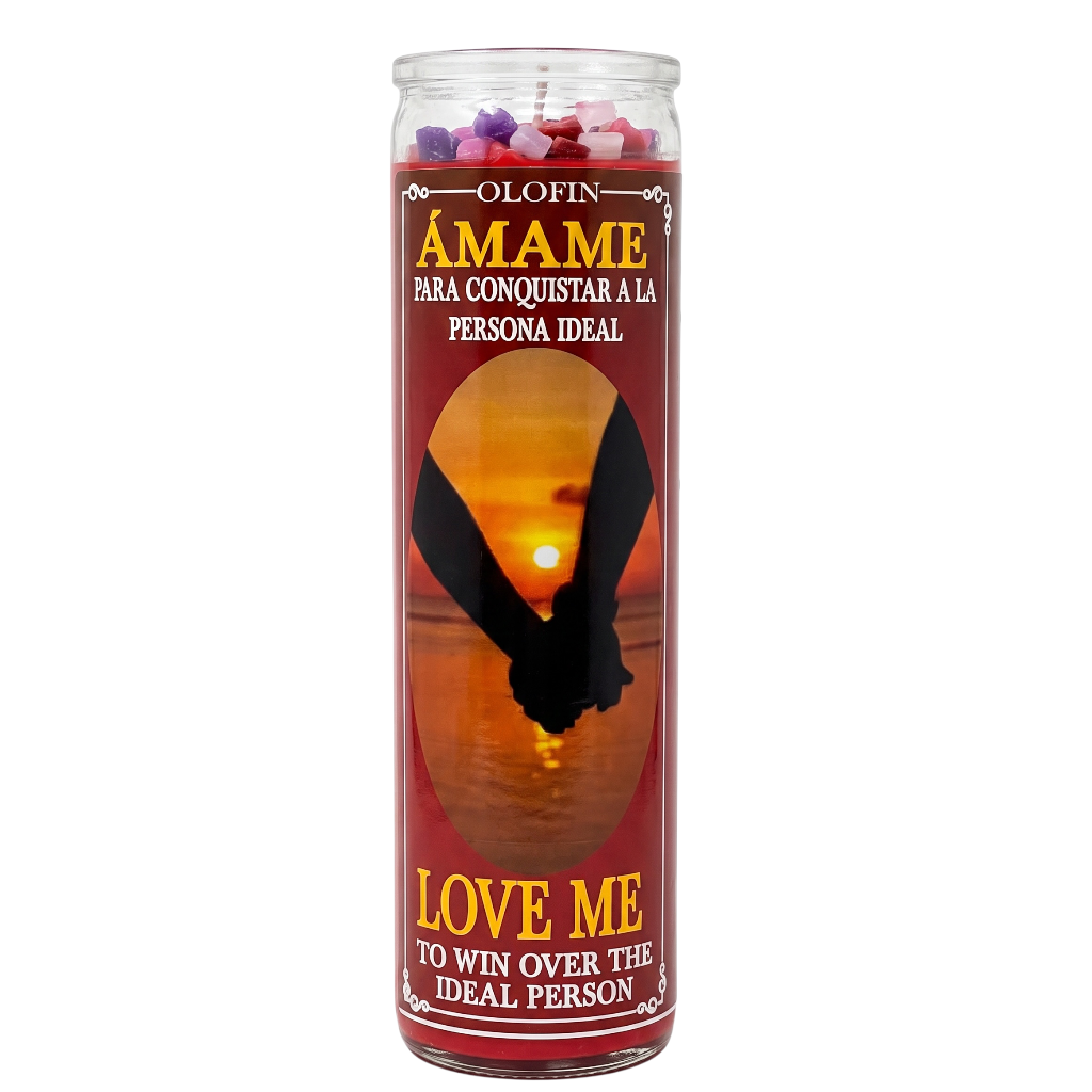 A tall glass jar candle with a red label featuring a sunset silhouette of two hands holding, with Spanish text reading 'Olofin Ámame' and 'Love Me to Win Over the Ideal Person'.