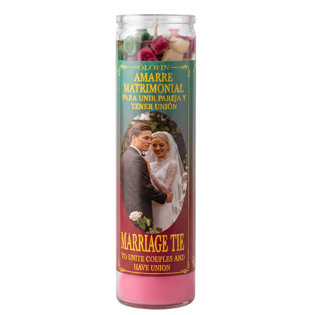 A tall glass prayer candle with pink wax and a printed label reading 'Olofin Amarre Matrimonial' and 'Marriage Tie,' featuring a bride and groom photo on the front.