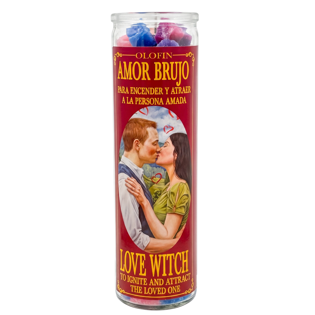 A tall glass prayer candle with a red label reading 'Amor Brujo' and 'Love Witch,' featuring an illustration of a couple kissing. The top of the candle is filled with colorful wax pieces in blue, pink, and purple.