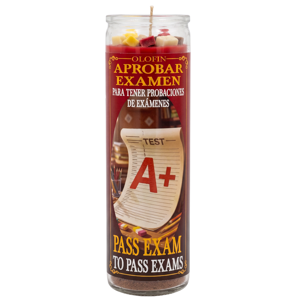A tall glass jar candle with a Spanish label reading 'O Lofin Aprobar Examen' and 'Pass Exam to Pass Exams,' featuring an A+ test paper graphic on a red and brown label.