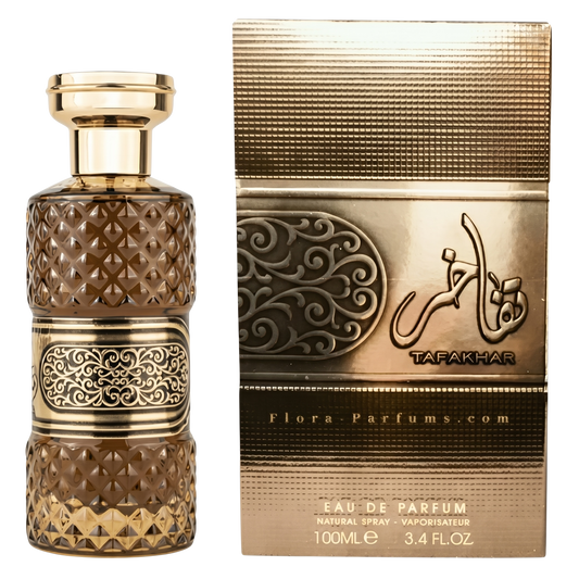 Decorative perfume bottle and packaging with intricate designs on a white background