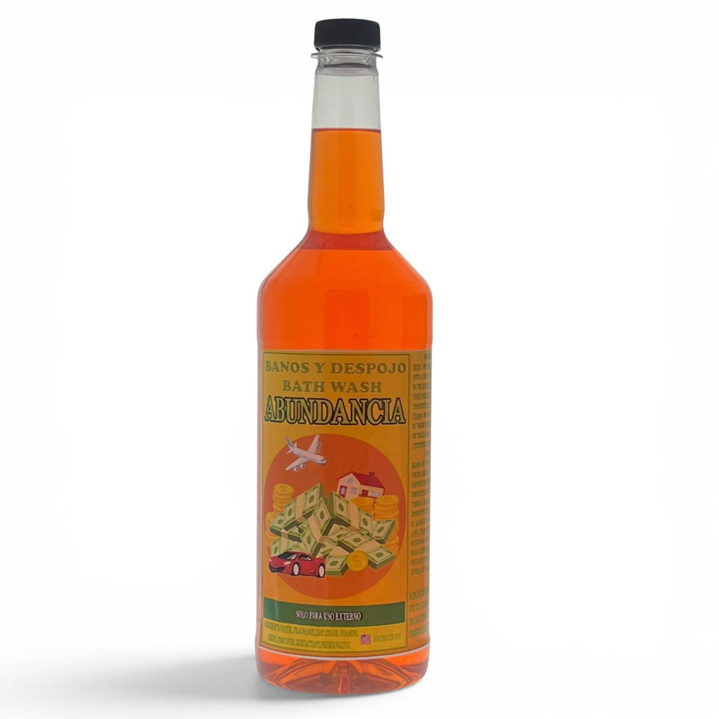 A bottle of Abundancia bath wash with orange liquid, featuring a yellow label with an illustration of money and a house, on a white background.