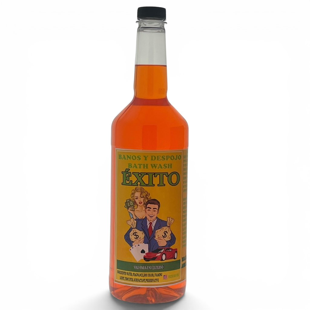A bottle of Éxito bath wash with orange liquid inside, featuring a yellow label with a cartoon illustration of a couple and children, and a black cap, set against a plain white background.