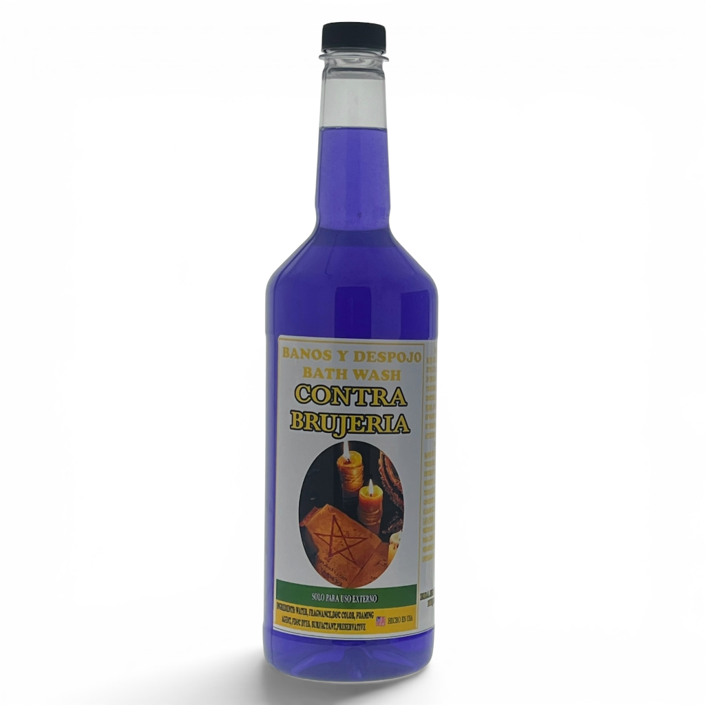 A bottle of purple-blue bath wash with a black cap and a cream-colored label reading 'CONTRA BRUJERIA' and 'BATH WASH'.