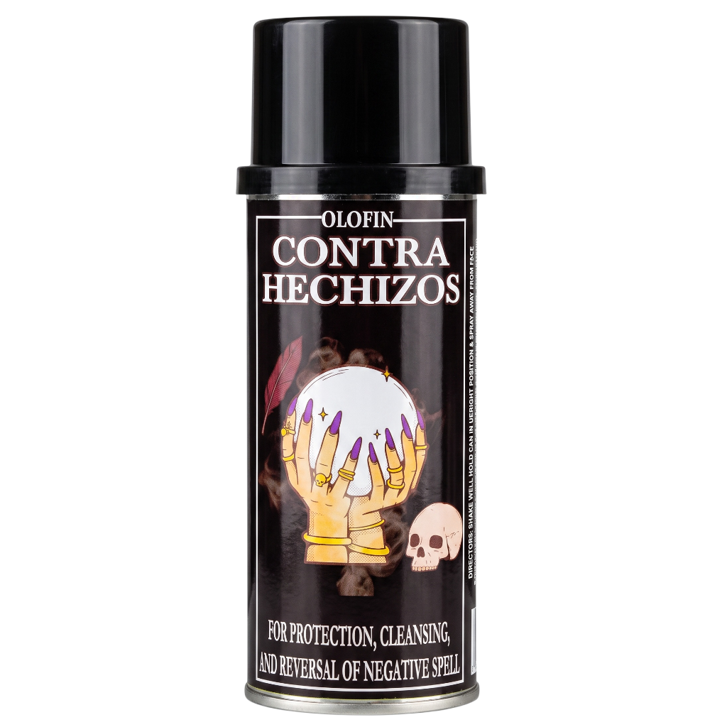 A black spray can of Olofin Contra Hechizos, featuring a label with a crystal ball and skeletal hands illustration, on a plain white background.