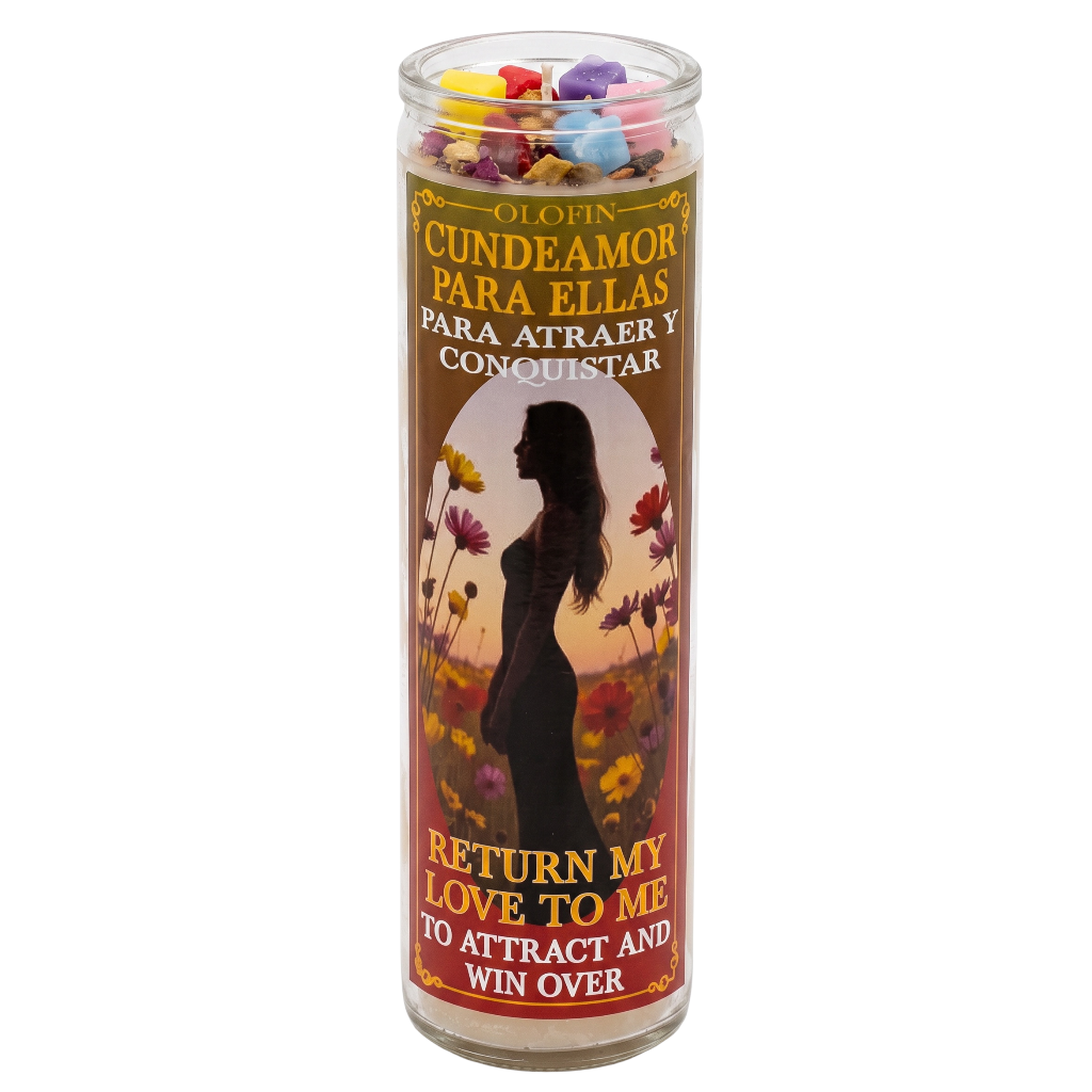 A tall glass jar candle with a printed label featuring a woman's silhouette, flowers, and Spanish and English text. The candle is filled with colorful wax pieces at the top and is shown on a plain white background.
