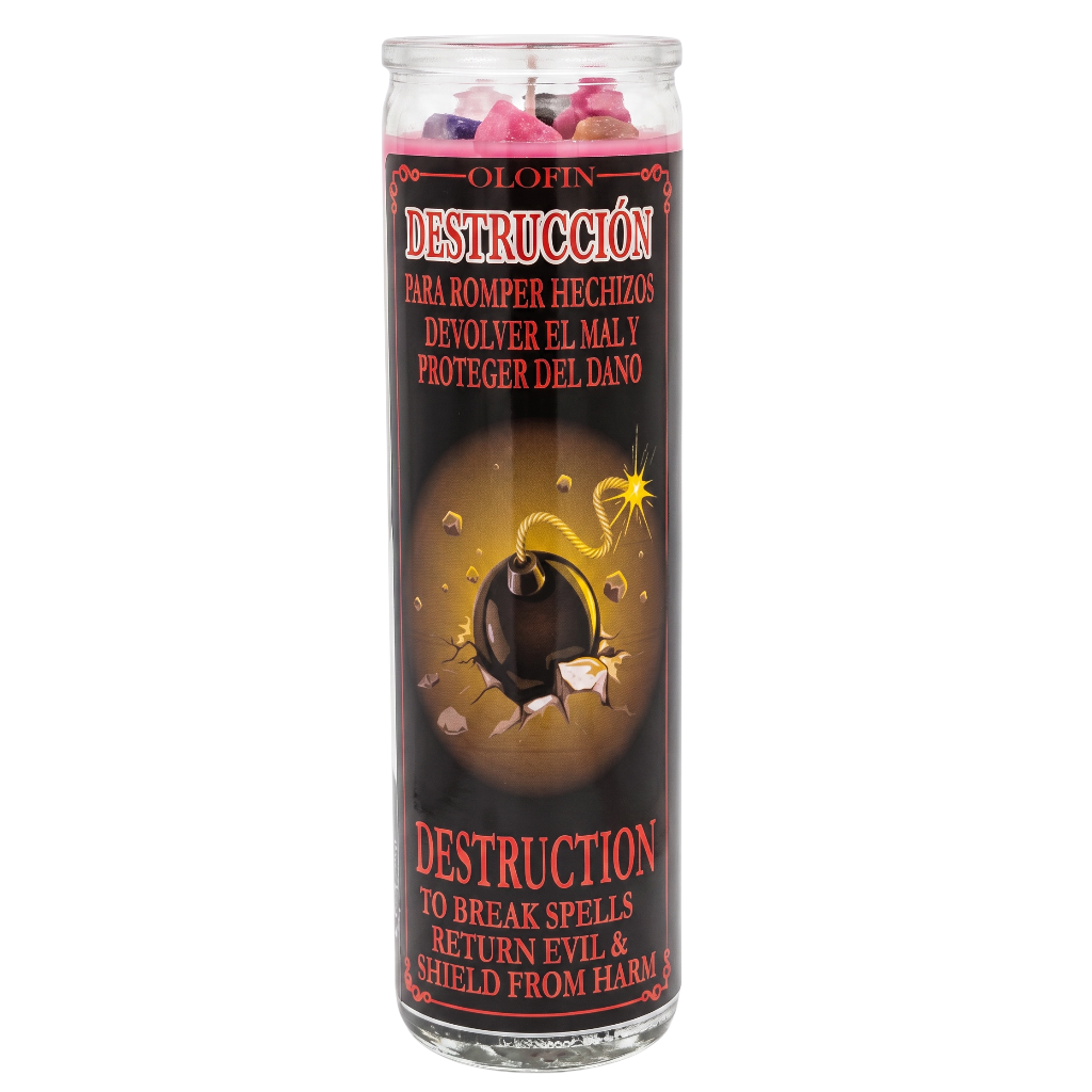 A tall glass jar candle labeled 'Olofin Destrucción' with a black label featuring a bomb illustration and red and white text, shown on a plain white background.