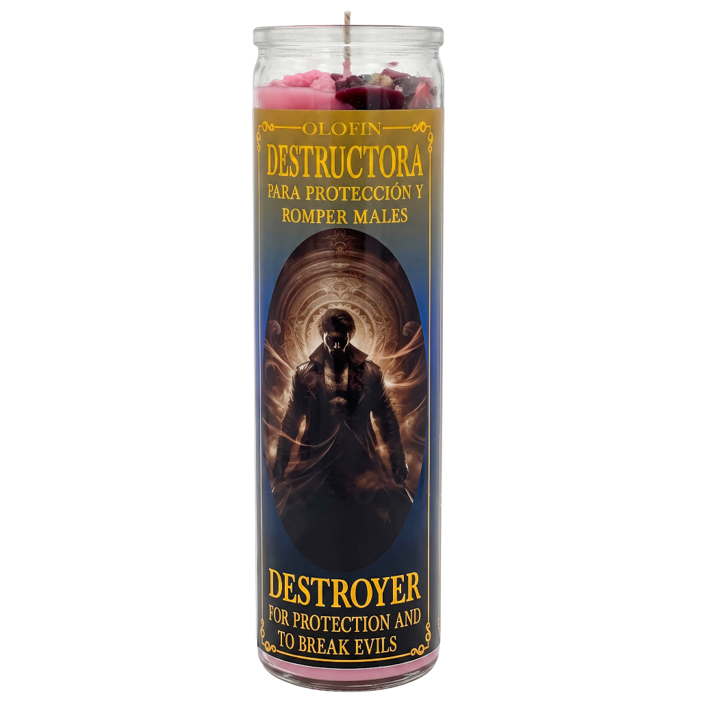A tall glass jar candle labeled 'Olofin Destructora' with Spanish text 'Para protección y romper males' and 'Destroyer for protection and to break evils.' The candle has pink wax at the top, a dark blue label with a hooded figure illustration, and gold/yellow text, shown on a plain white background.