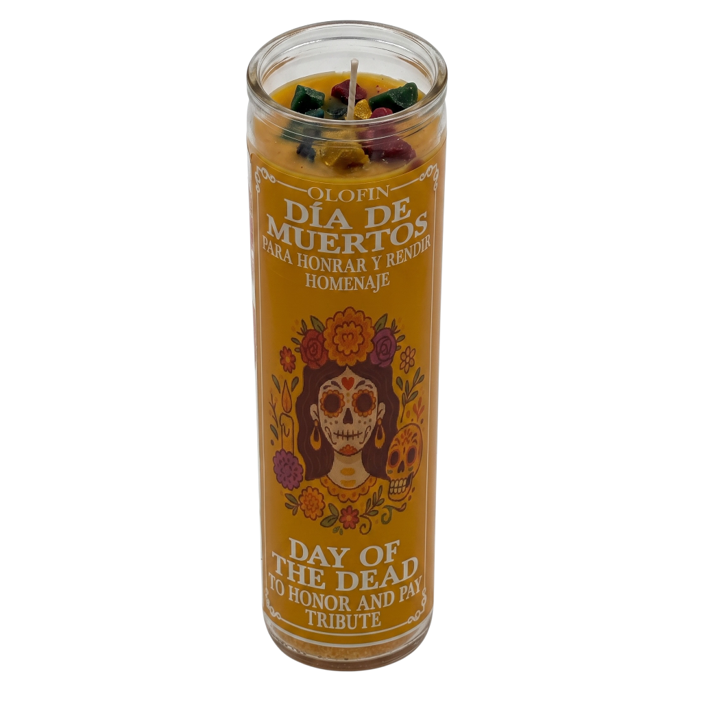 A tall glass jar candle with a yellow-orange label reading 'Olofin Dia de Muertos Day of the Dead' and featuring a sugar skull illustration, shown on a plain white background.