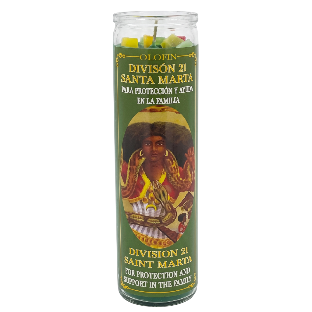 A tall clear glass prayer candle with a green printed label reading 'Olofin División 21 Santa Marta' and showing an illustrated figure, photographed on a plain white background.