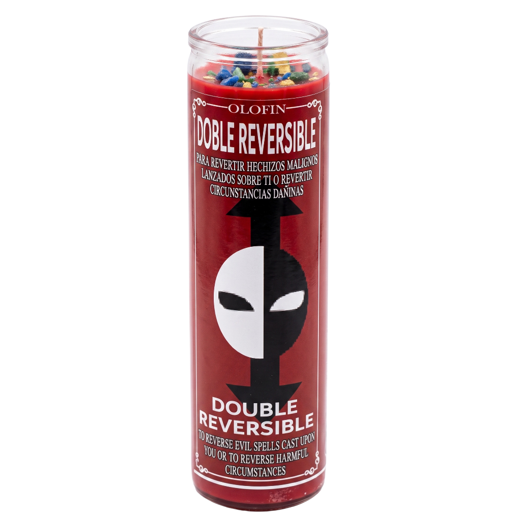 A tall glass jar candle with a red label reading 'Olofin Double Reversible' and a black-and-white face graphic, shown on a plain white background.
