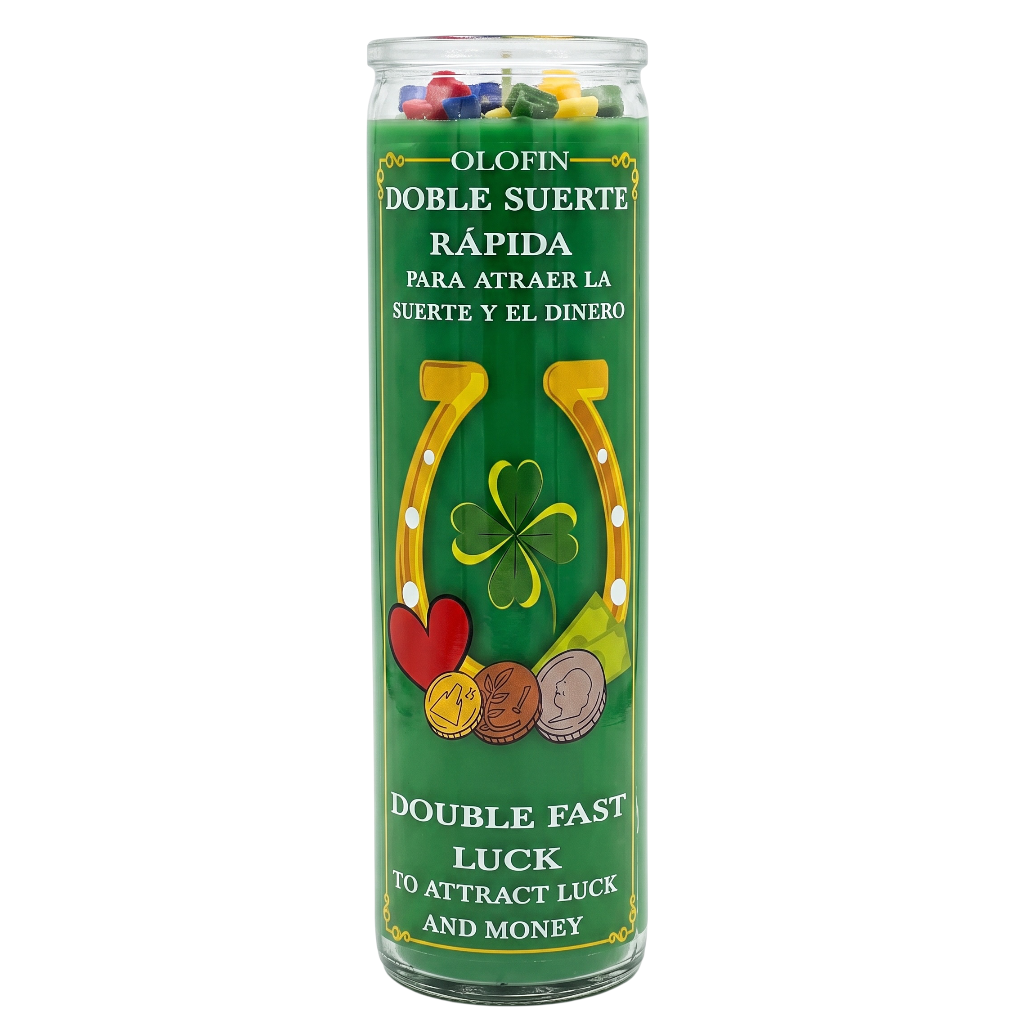 A tall glass jar candle with a green label featuring a yellow horseshoe, four-leaf clover, red heart, and coins. The label reads 'OLOFIN DOBLE SUERTE RÁPIDA' and 'DOUBLE FAST LUCK TO ATTRACT LUCK AND MONEY'.