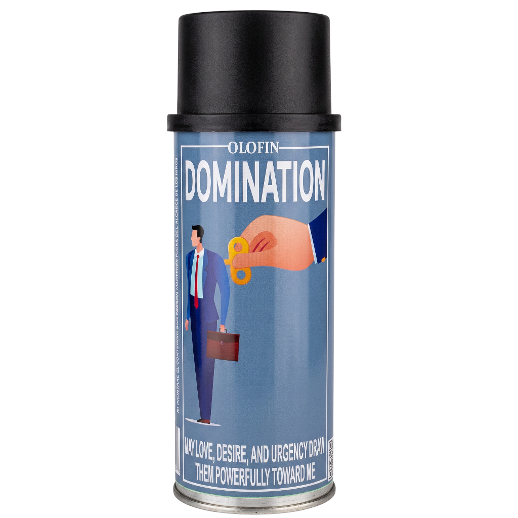 A single aerosol spray can of Olofin Domination hair product on a plain white background. The can has a black cap, a blue label with white text and an illustration of a hand giving a key to a suited man, and a silver metal base.
