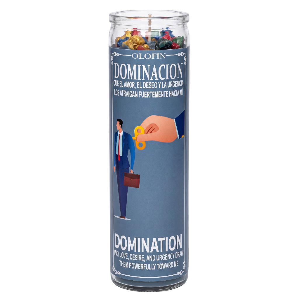A tall glass jar candle with a blue label reading 'OLOFIN DOMINACION' and showing an illustration of a hand giving a gold key to a businessman. The candle is filled with colorful flower-like wax pieces at the top and is photographed on a plain white background.