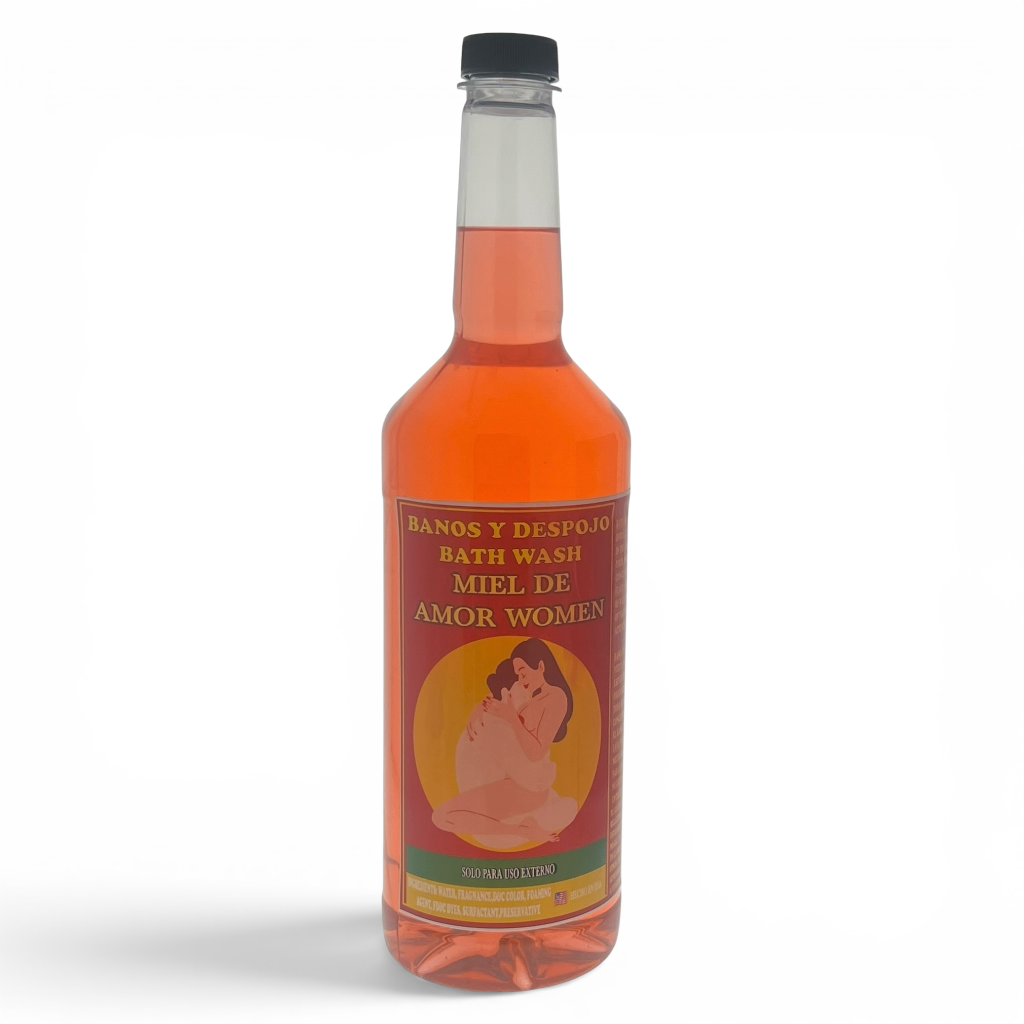 A bottle of Miel De Amor Women bath wash with a black cap, containing a translucent orange liquid, set against a plain white background.