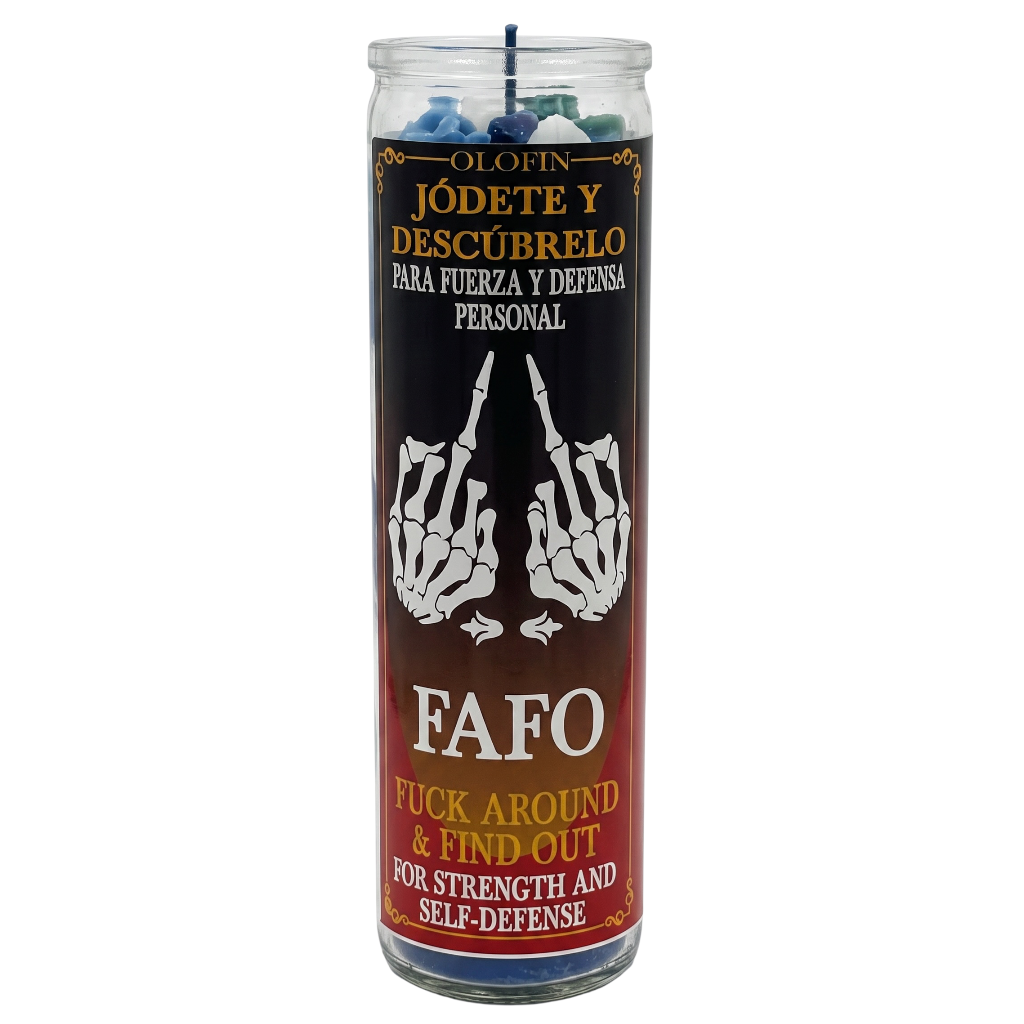 A tall glass jar candle with a black and red label featuring white skeleton hands and Spanish and English text. The label reads 'Olafin Jódete y Descúbrelo para Fuerza y Defensa Personal' and 'FAFO Fuck Around & Find Out for Strength and Self-Defense.
