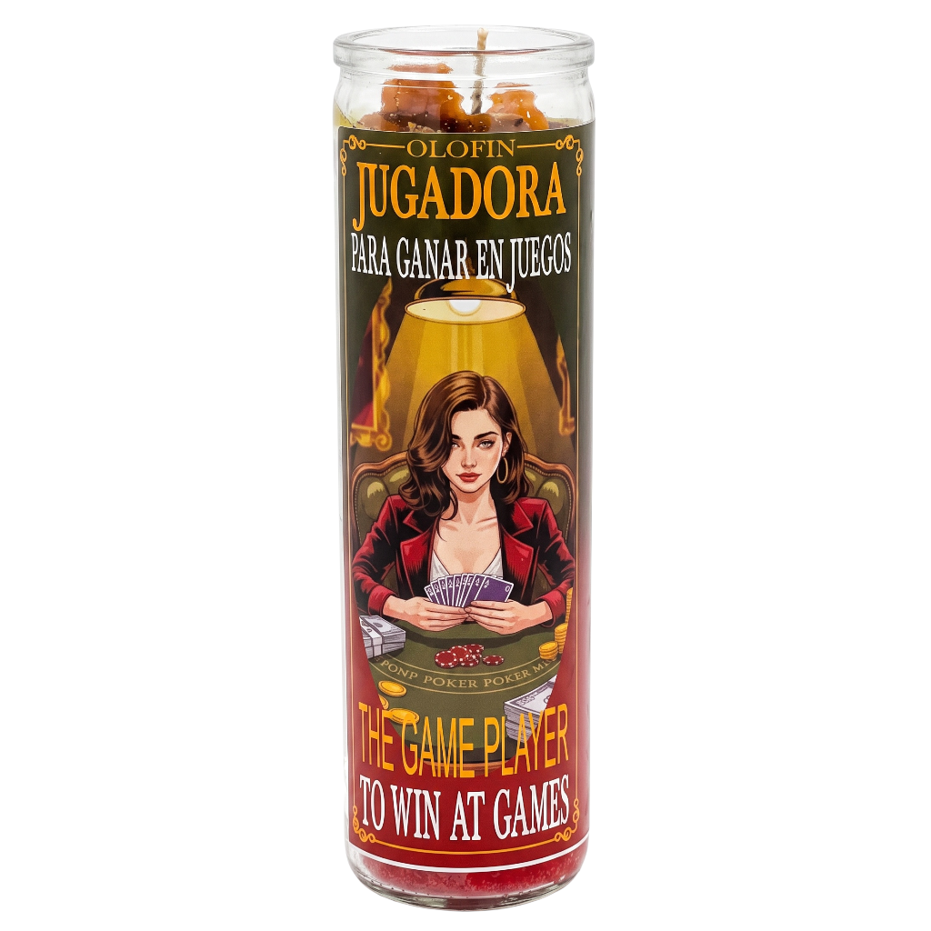 A tall glass jar candle with a printed label featuring a woman at a card table and Spanish and English text reading 'Olofin Jugadora' and 'The Game Player to Win at Games.' The candle is shown upright on a plain white background.
