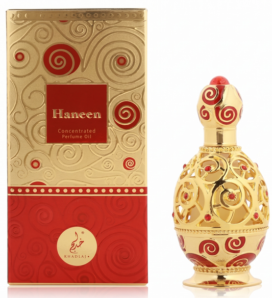 Gold and red Haneen concentrated perfume oil with packaging on a white background