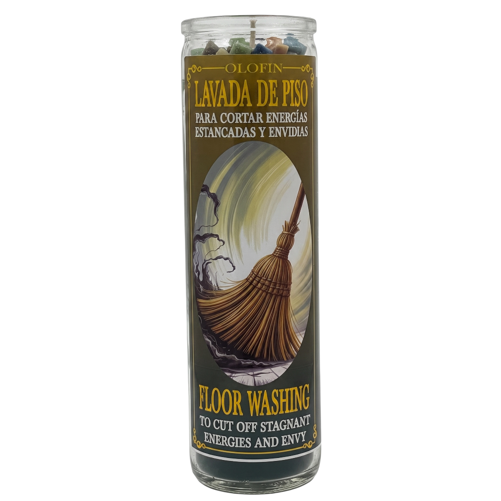 A tall glass jar candle labeled 'Olofin Lavada de Piso Floor Washing' with a broom illustration and Spanish text for cutting off stagnant energies and envying.