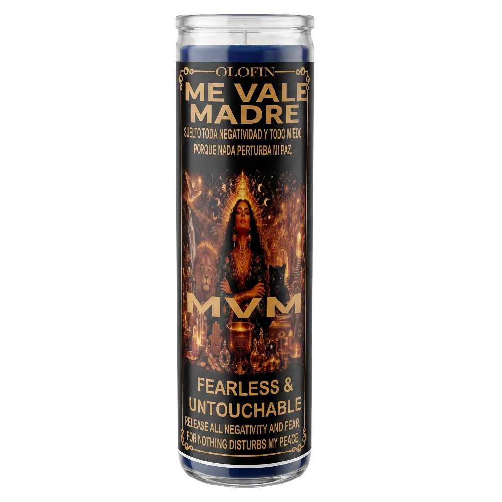 A tall glass prayer candle with a dark label reading 'Olofin Me Vale Madre' and 'Fearless & Untouchable,' featuring a fiery religious illustration and the text 'MVM' in large gold letters, shown on a plain white background.