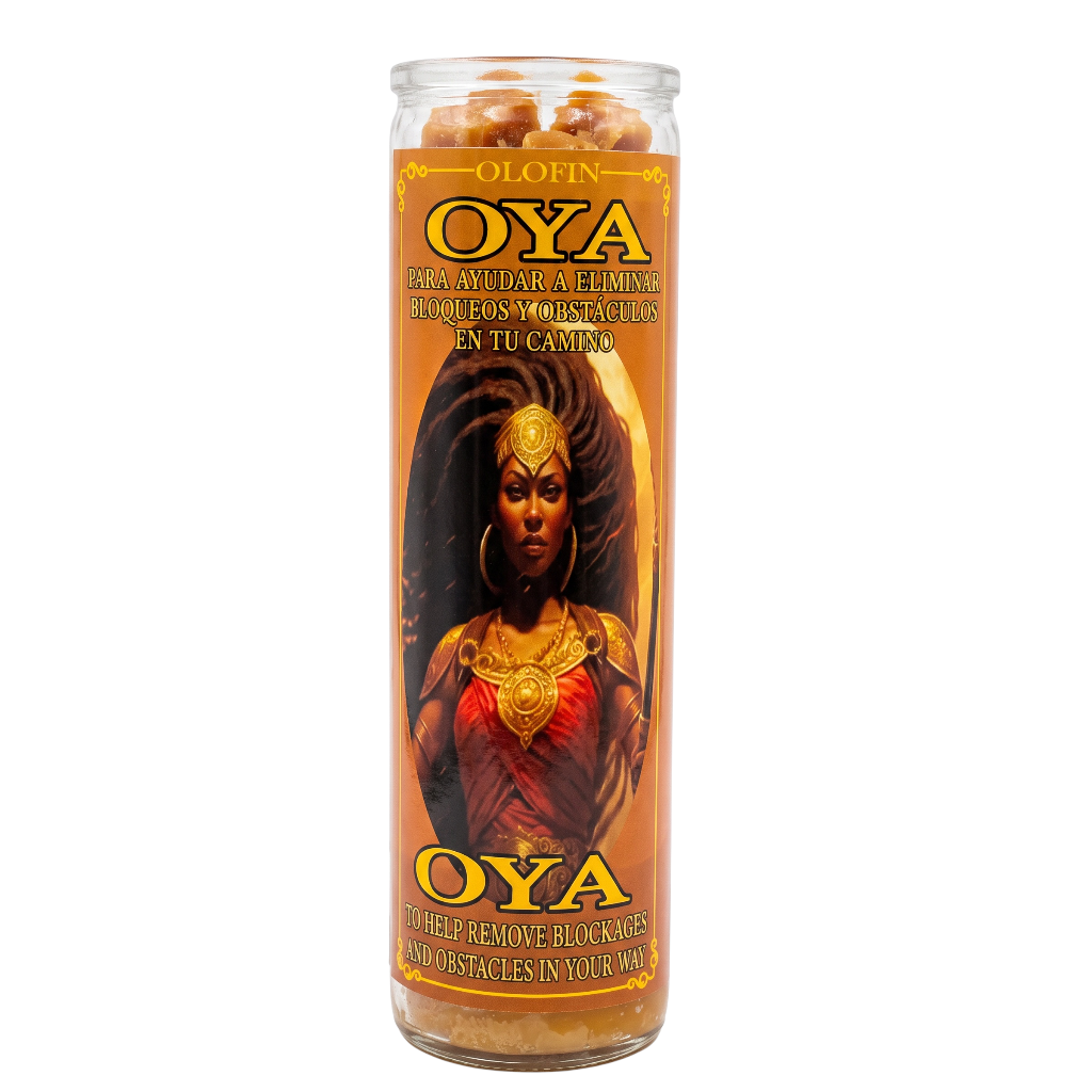 A tall clear glass jar candle labeled 'Olofin Oya' with a warm orange label featuring an illustration of an Oya deity and text for removing blockages and obstacles.