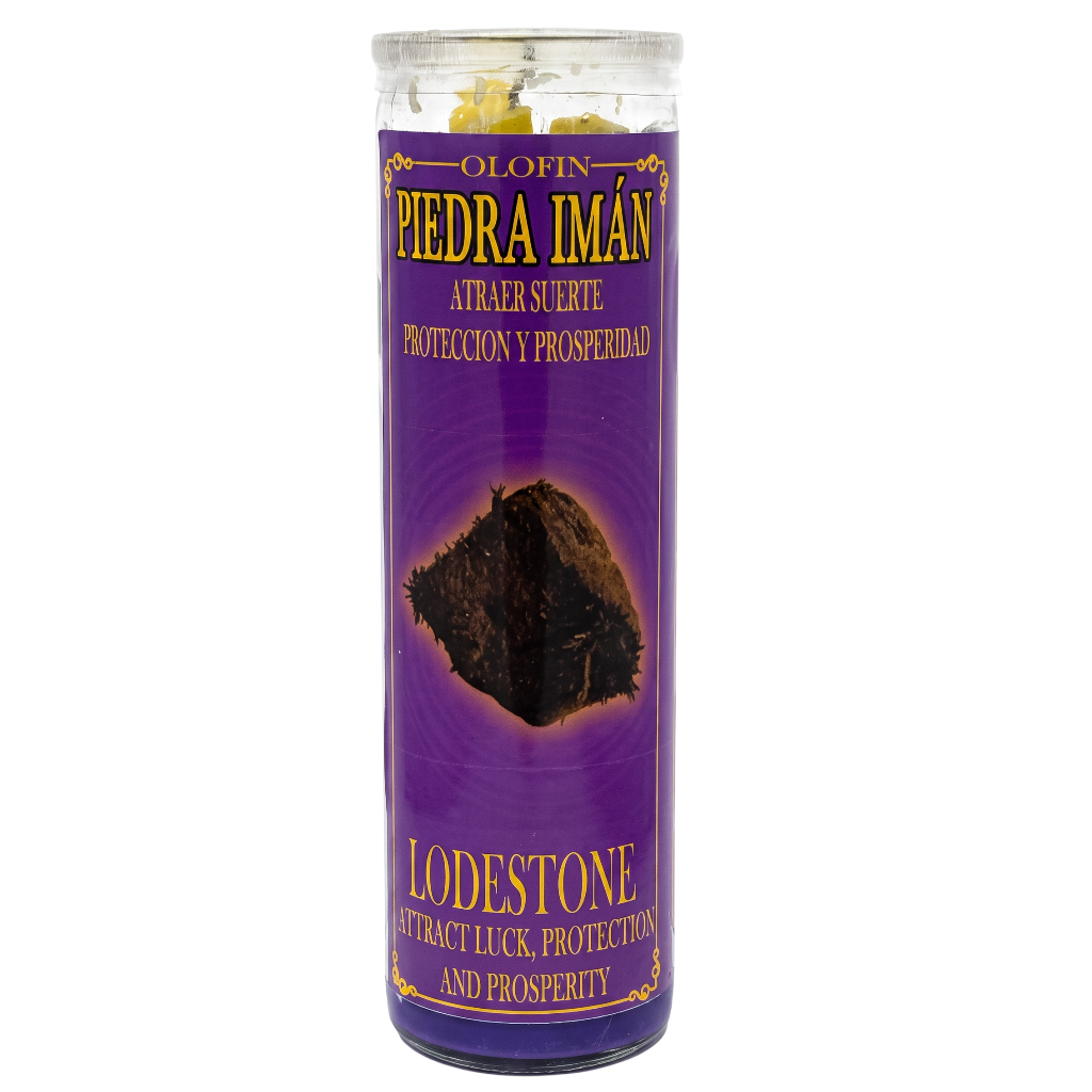 A tall cylindrical glass jar containing yellow Olofin Piedra Imán (Lodestone) crystals, set inside a purple label with gold lettering.