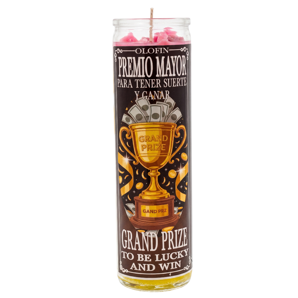 A tall glass jar candle with a dark brown label featuring a gold trophy illustration and Spanish text reading 'Premio Mayor' and 'Grand Prize to Be Lucky and Win.' The candle is filled with pink wax at the top and contains yellow liquid at the bottom.