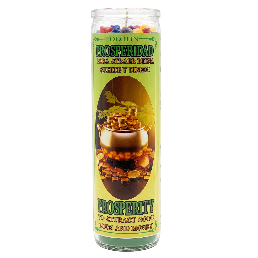 A tall glass jar candle with a green and yellow label reading 'Olofin Prosperidad' and 'Do Attract Good Luck and Money,' featuring a pot of gold illustration and multicolored wax pieces visible at the top.