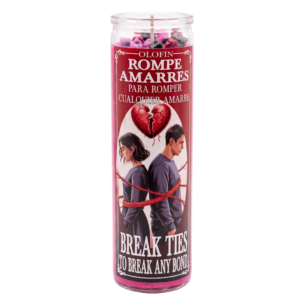 A tall glass jar candle with a red and white printed label featuring a broken heart and the text 'Olofin Rompe Amarres' and 'Break Ties To Break Any Bond!'.