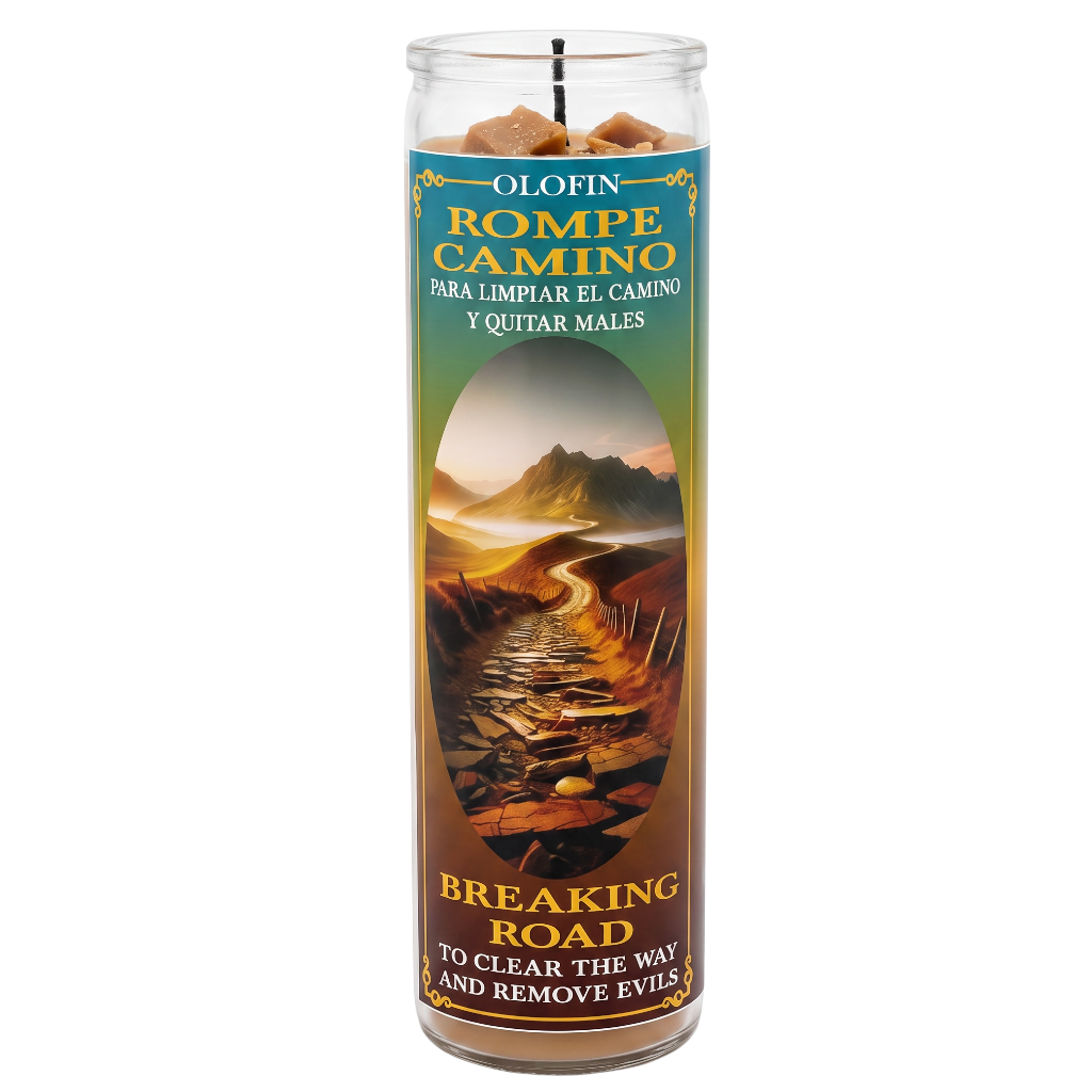 A tall glass prayer candle with a printed label reading 'Olofin Rompe Camino' and 'Breaking Road,' showing a scenic road through mountains and a dark figure silhouette. The candle is photographed on a plain white background.