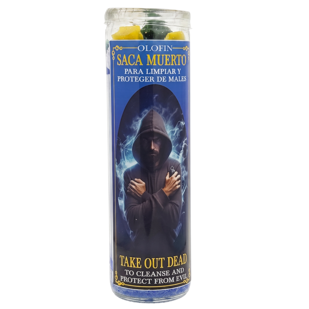 A tall glass jar candle labeled 'OLIN SAGA MUERTO' with a blue label showing a hooded figure and text including 'TAKE OUT DEAD TO CLEANSE AND PROTECT FROM EVIL'. Yellow and green wax pieces are visible at the top.