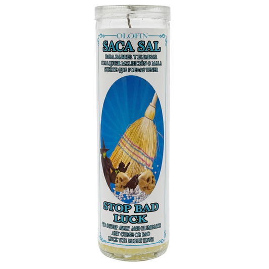 A tall clear glass prayer candle with a white label featuring the brand 'Olofin' and product name 'Saca Sal'. The label has a blue sunburst background with an illustration of a yellow and red thatched hut, alongside the text 'Stop Bad Luck'.