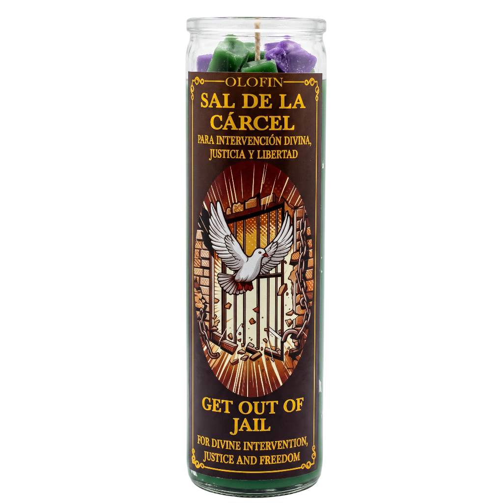 A tall glass jar candle with a dark brown label reading 'Olofin Sal de la Cárcel / Get Out of Jail' and an illustration of a dove breaking a cage. Green and purple wax pieces are visible at the top, on a plain white background.