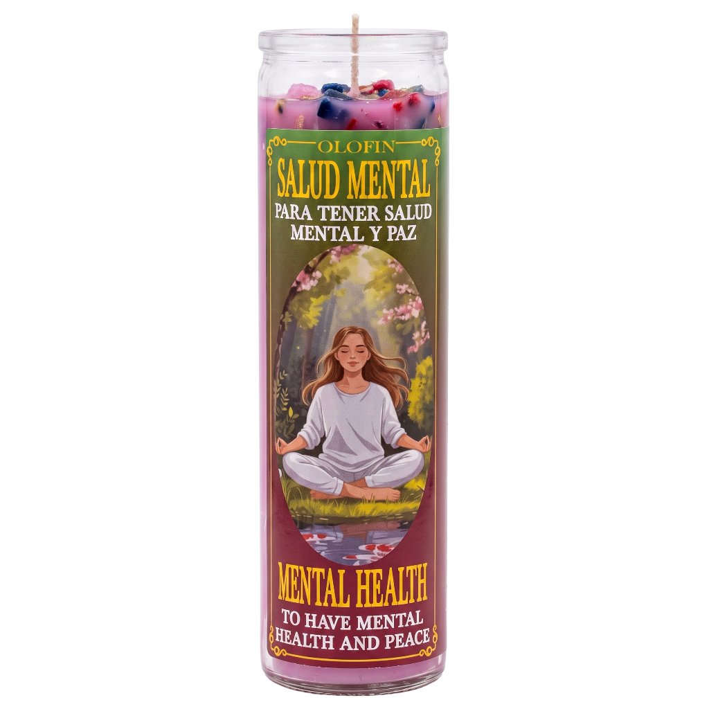 A tall glass prayer candle with a colorful printed label featuring the Spanish text 'OLOFIN SALUD MENTAL PARA TENER SALUD MENTAL Y PAZ' and 'MENTAL HEALTH TO HAVE MENTAL HEALTH AND PEACE,' plus an illustration of a woman meditating outdoors. The candle wax at the top is pink with small multicolored flower-like accents.
