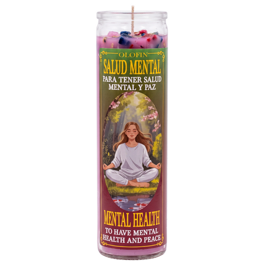 A tall glass prayer candle with a colorful printed label featuring the Spanish text 'OLOFIN SALUD MENTAL PARA TENER SALUD MENTAL Y PAZ' and 'MENTAL HEALTH TO HAVE MENTAL HEALTH AND PEACE,' plus an illustration of a woman meditating outdoors. The candle wax at the top is pink with small multicolored flower-like accents.