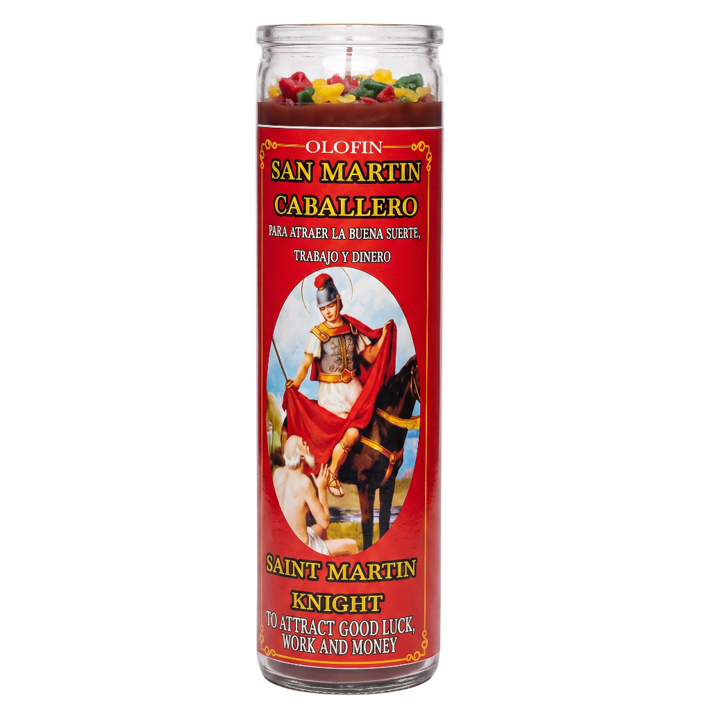 A tall glass jar candle labeled 'Olofin San Martin Caballero' featuring a red label with a Saint Martin knight illustration and multicolored wax pieces visible at the top, on a white background.