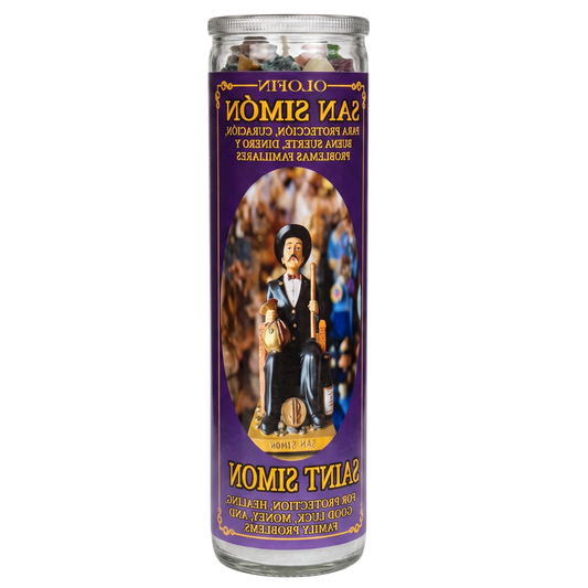 A tall glass jar prayer candle with a purple label featuring Saint Simon, shown on a plain white background. The label includes Spanish and English text and an illustration of the saint.